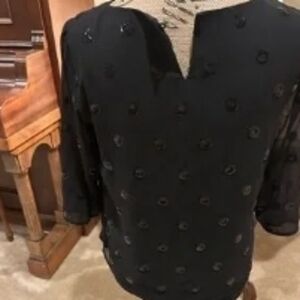 Stylish Black Top with Circular Accents